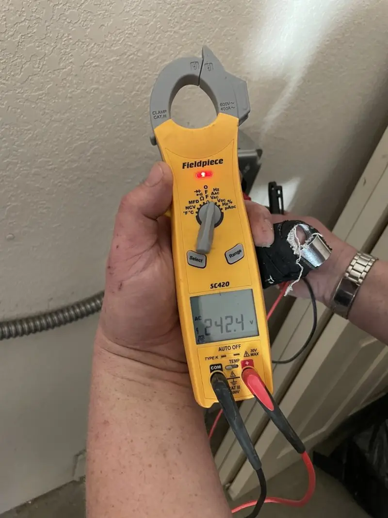 Voltage testing with clamp meter during Outlet Installation in Mankato